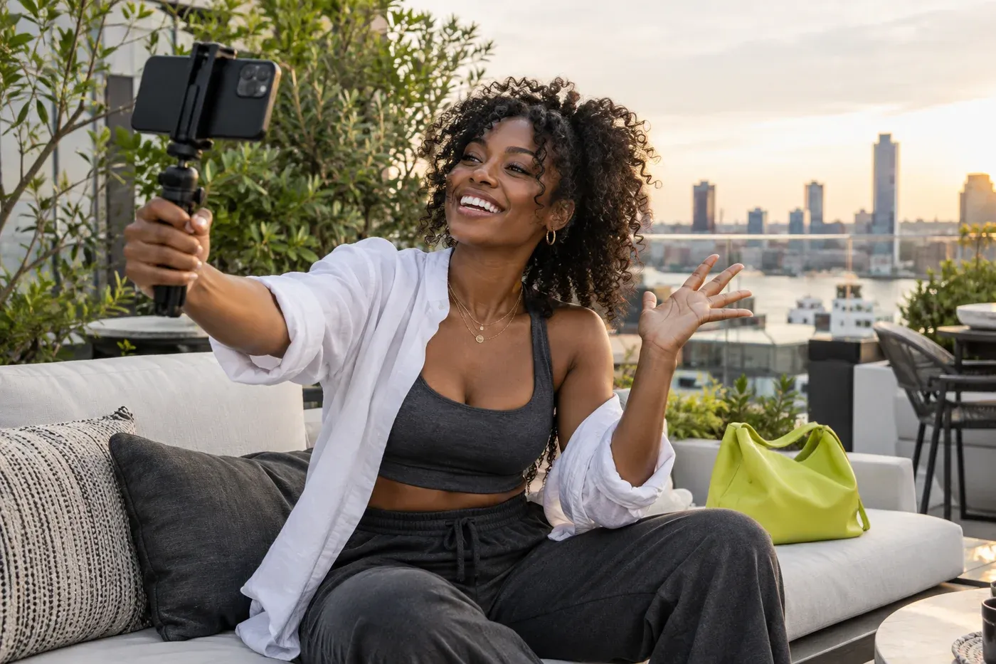 A travel creator recording a lifestyle video on a rooftop terrace