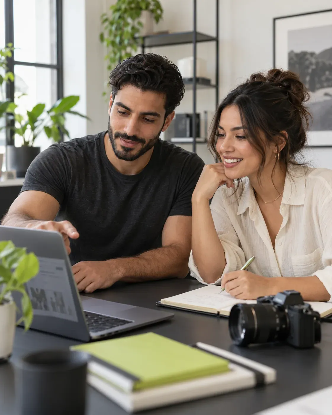 Two creators planning content, reviewing their business, and sharing ideas in a daylight studio